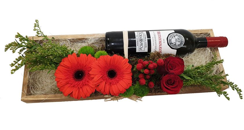 Arrangement of wines and flowers