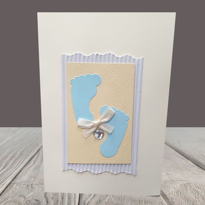 Handmade card with babys foot for a boy.